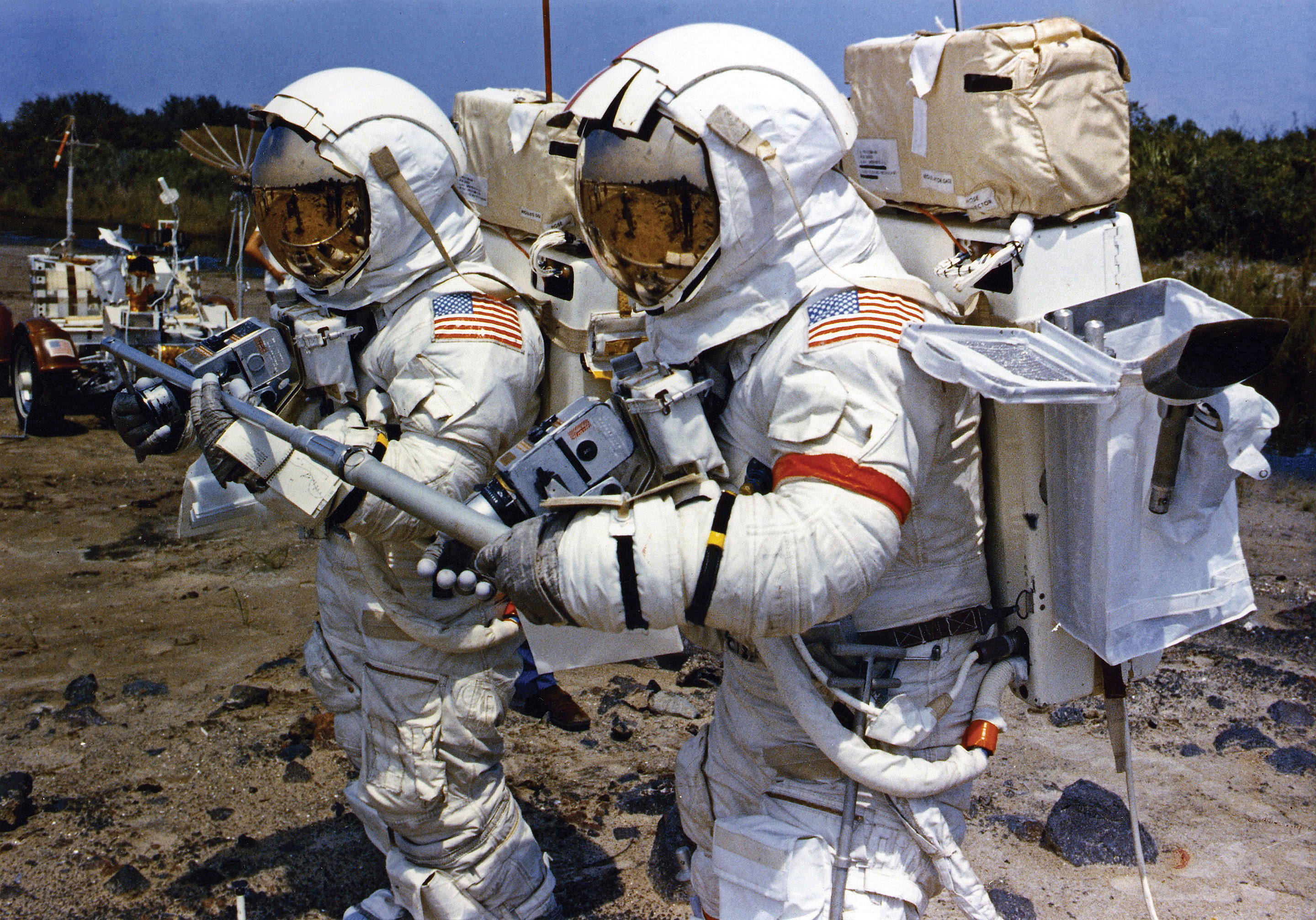 Apollo 17 crew members Gene Cernan and Harrison Schmitt work together during a lunar EVA simulation at Kennedy Space Center in Florida. They are the last humans to walk upon the surface of the Moon. Credit: NASA via J.L. Pickering/Retro Space Images