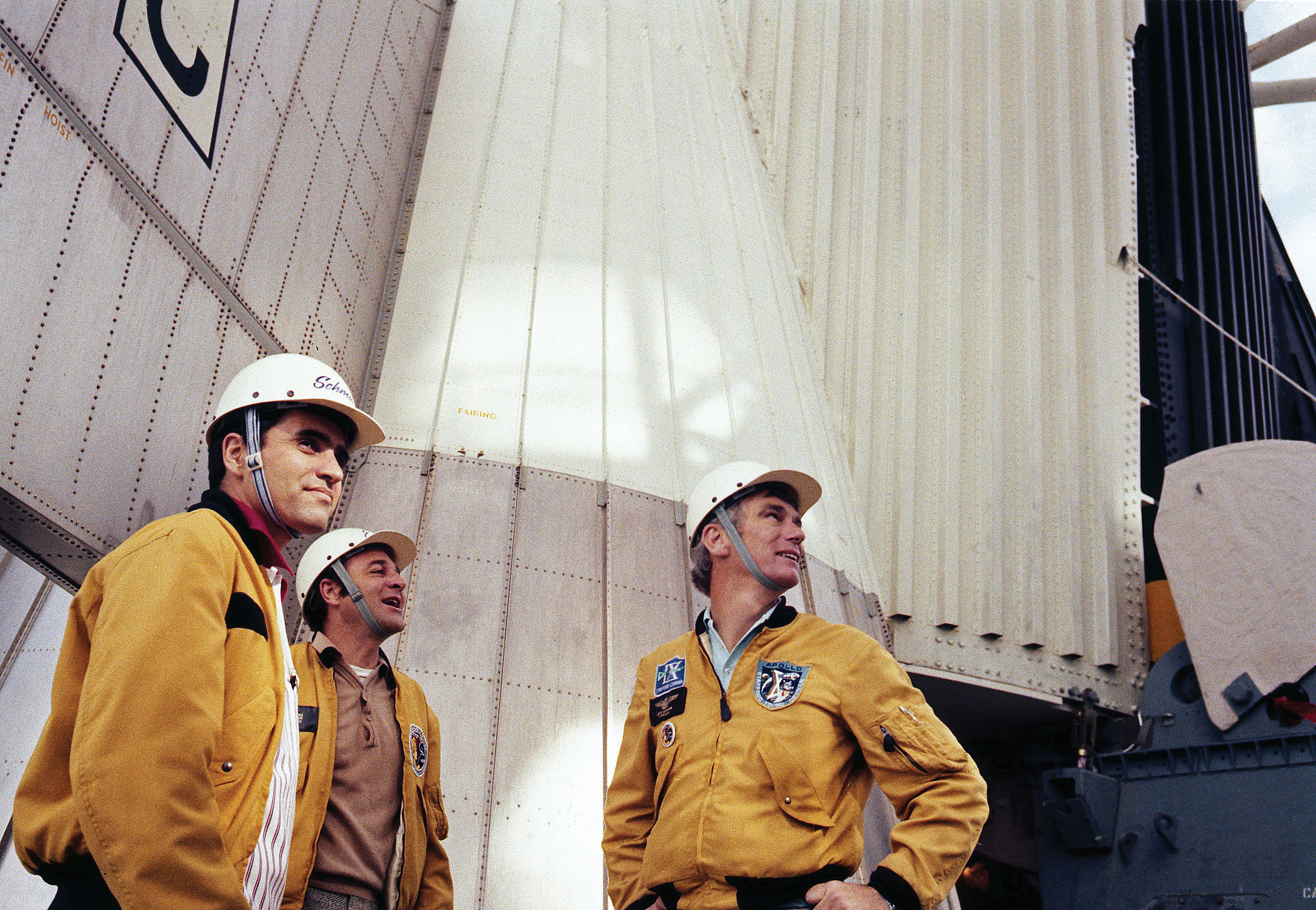 Harrison Schmitt, Ron Evans, and Gene Cernan stand at the base of their Saturn V rocket during a visit to the pad just days before the launch of Apollo 17. Credit: NASA via J.L. Pickering/Retro Space Images