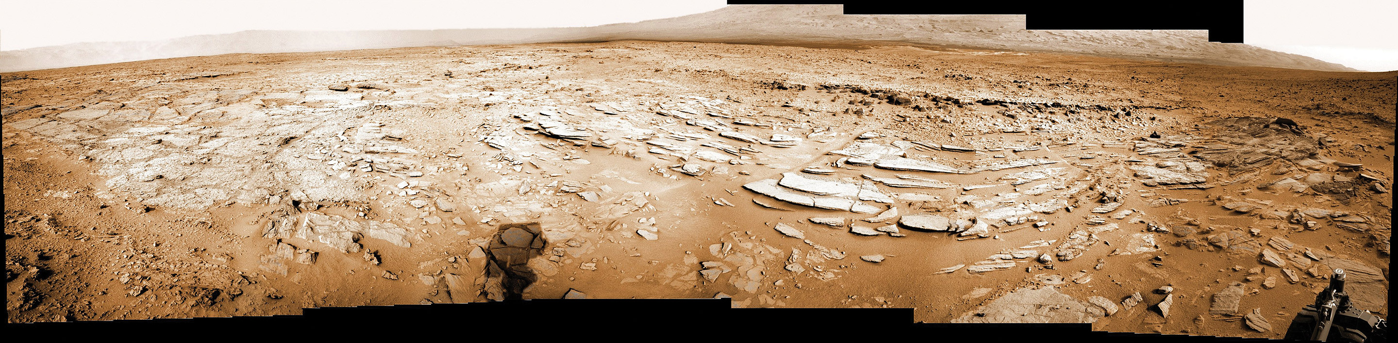 Sol 120 colorized panorama shows big Shaler layered rock outcrop snapped by Curiosity’s right eye Navigation Camera (Navcam) on Dec. 7, 2012. Shaler exhibits a pattern known as ‘crossbedding’, at angles to one another. Mount Sharp visible in the background. Credit: NASA/JPL-Caltech/Ken Kremer/Marco Di Lorenzo