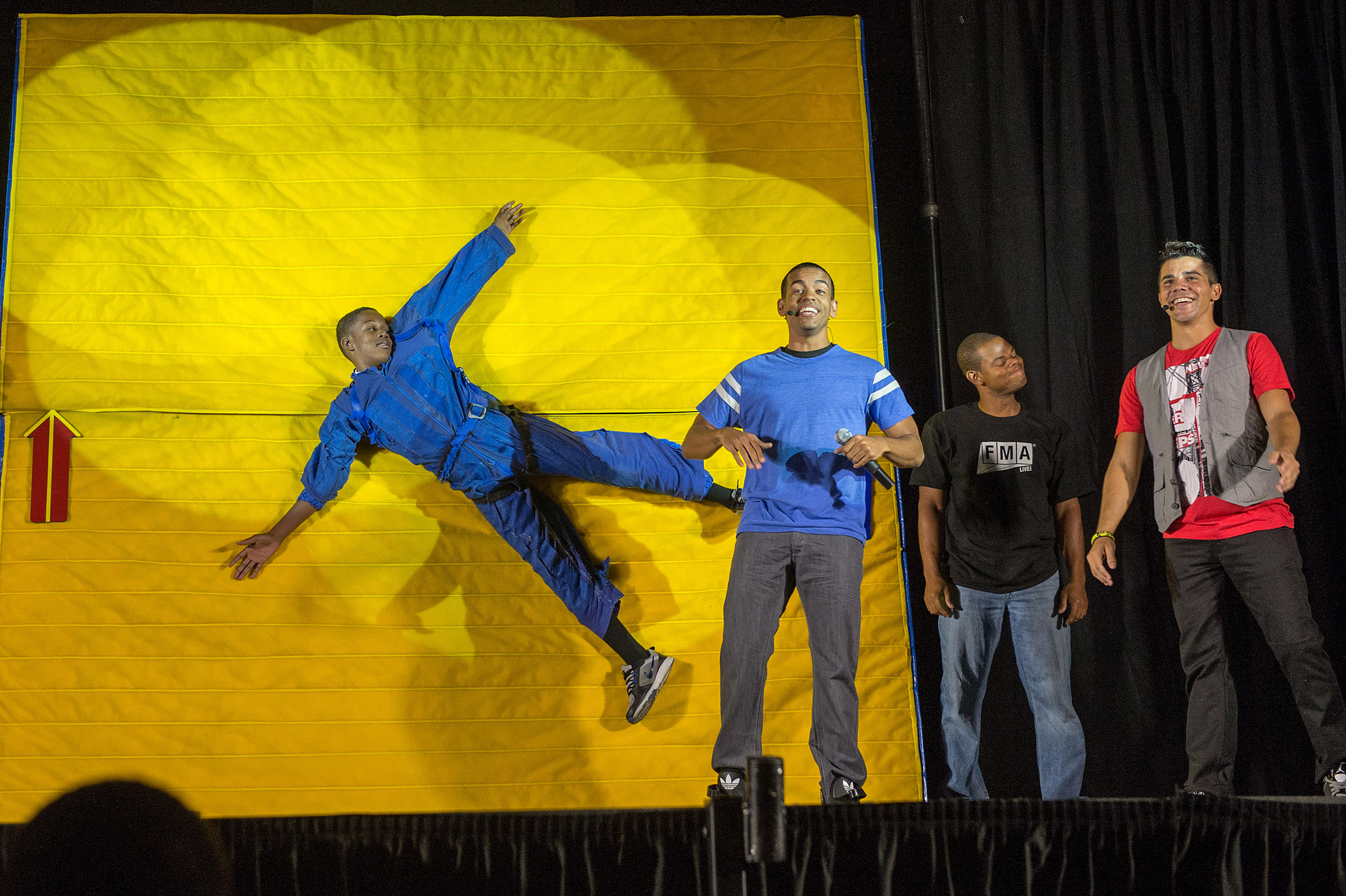 With the help of a student participant, “FMA Live!” crew members explain Newton’s first law of motion at Hardy Middle School in Washington on Sept. 16th, 2013. “FMA Live!” travels across the country and has reached nearly 300,000 students. Image: NASA/Jay Westcott