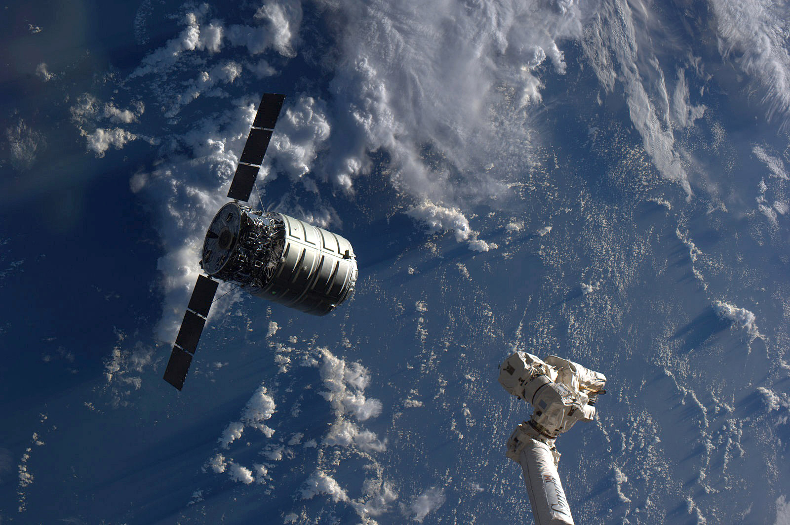 The Cygnus cargo spacecraft is just a few feet away from the International Space Station’s Canadarm2. Credit: NASA