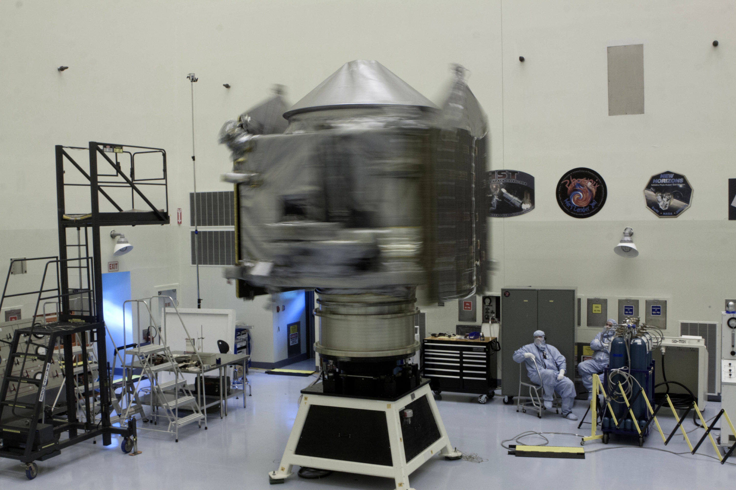 Inside the Payload Hazardous Servicing Facility at Kennedy Space Center in Florida, engineers and technicians perform a spin test of the MAVEN spacecraft. The operation is designed to verify that MAVEN is properly balanced as it spins during the initial mission activities. Photo: NASA/Kim Shiflett