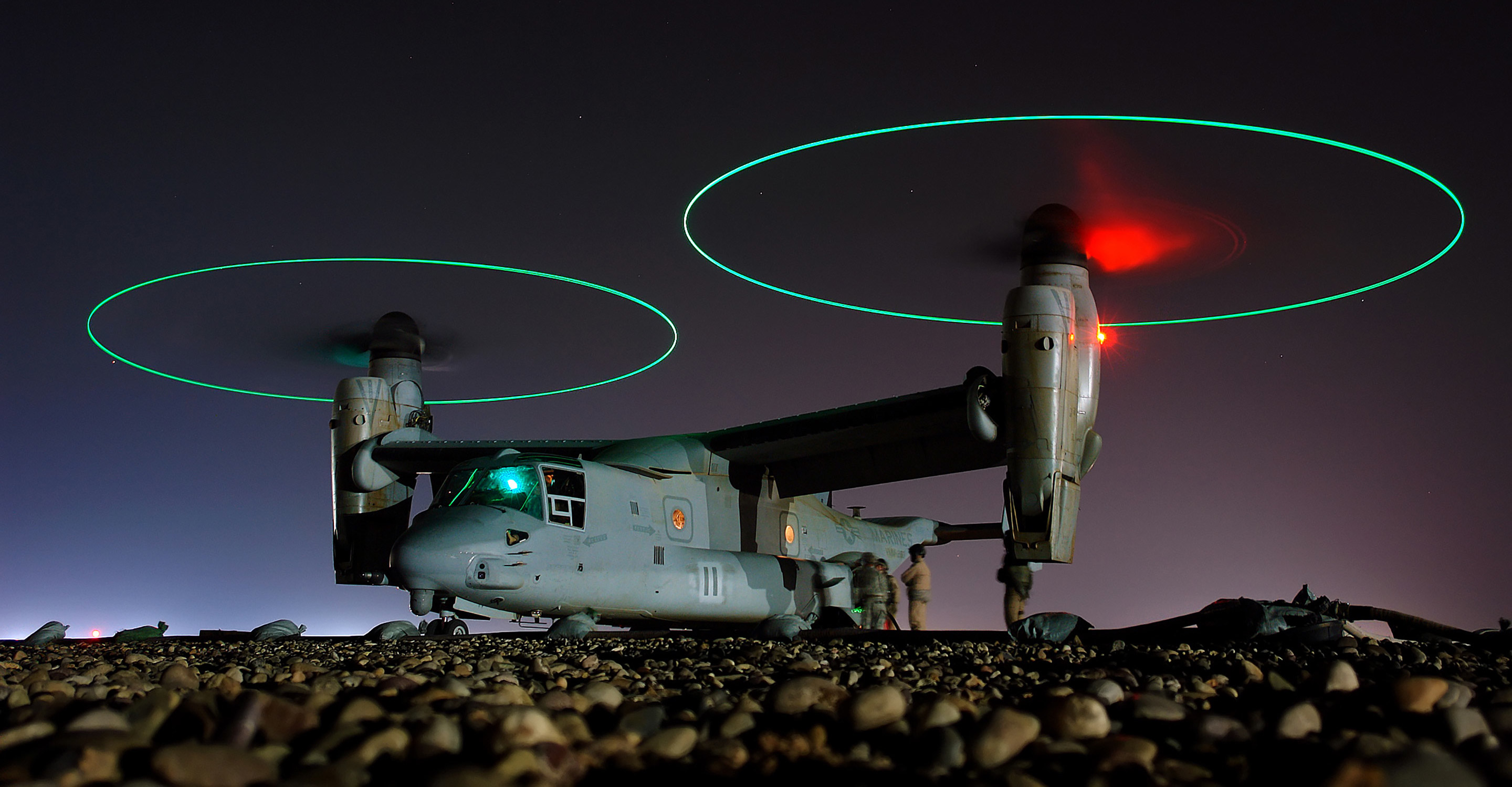 Crew members refuel an V-22 Osprey before a night mission in central Iraq.Photo: U.S Navy/Chief Petty Officer Joe Kane