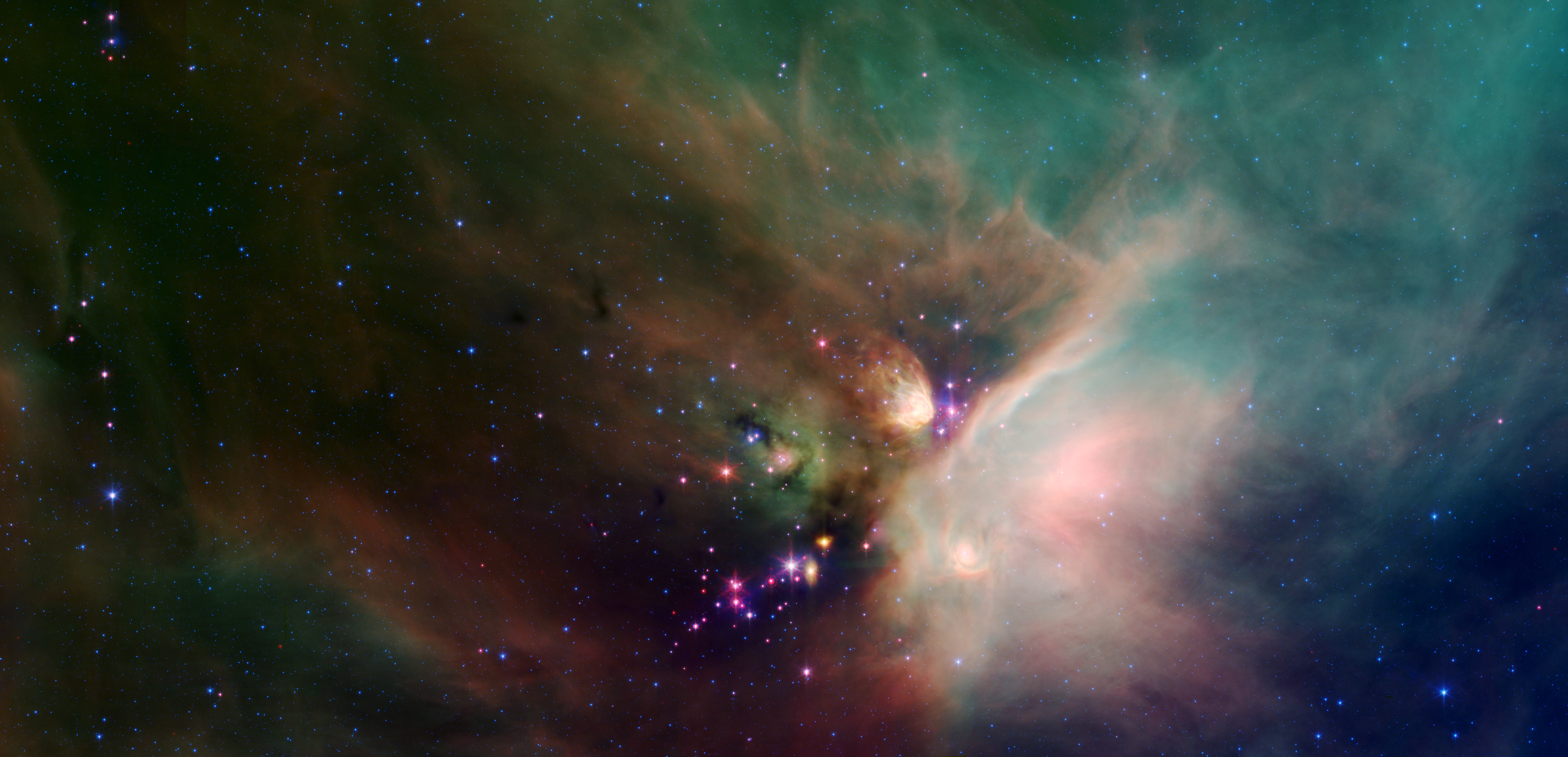Young Stars Cradled in Dust: Newborn stars peek out from beneath their natal blanket of dust in this dynamic image of the Rho Ophiuchi dark cloud from Spitzer. Credit: NASA/JPL-Caltech/Harvard-Smithsonian CfA