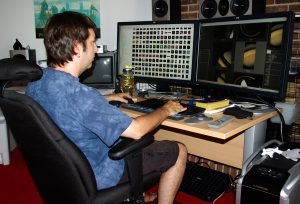 Stephen Van Vuuren works in his basement studio on the IMAX film “In Saturn’s Rings” which will be released this July. Photo: SV Studios