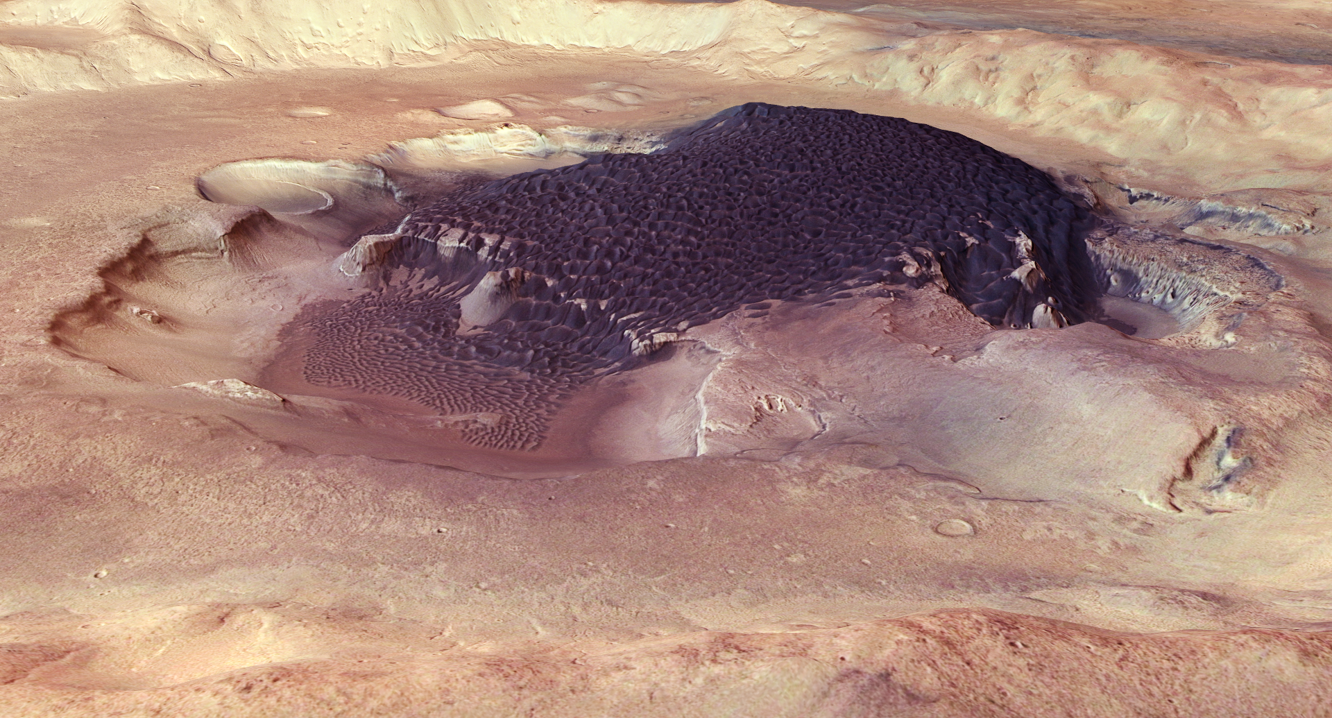Rabe Crater is a 108 km-wide impact crater with an intricately shaped dune field. The dune material likely comprises locally eroded sediments that have been shaped by prevailing winds. The image resolution is about 15 m per pixel.Credit: ESA/DLR/FU Berlin