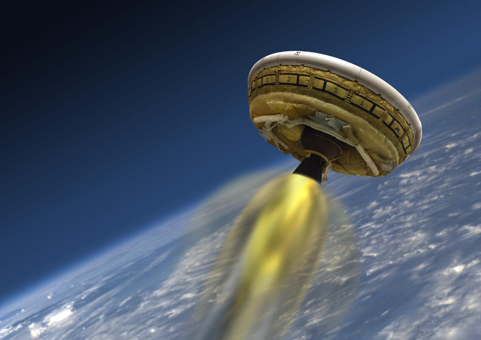 This artist's concept shows the test vehicle for NASA's Low-Density Supersonic Decelerator (LDSD), designed to test landing technologies for future Mars missions. A balloon will lift the vehicle to high altitudes, where a rocket will take it even higher, to the top of the stratosphere, at several times the speed of sound. Credit: NASA/JPL-Caltech
