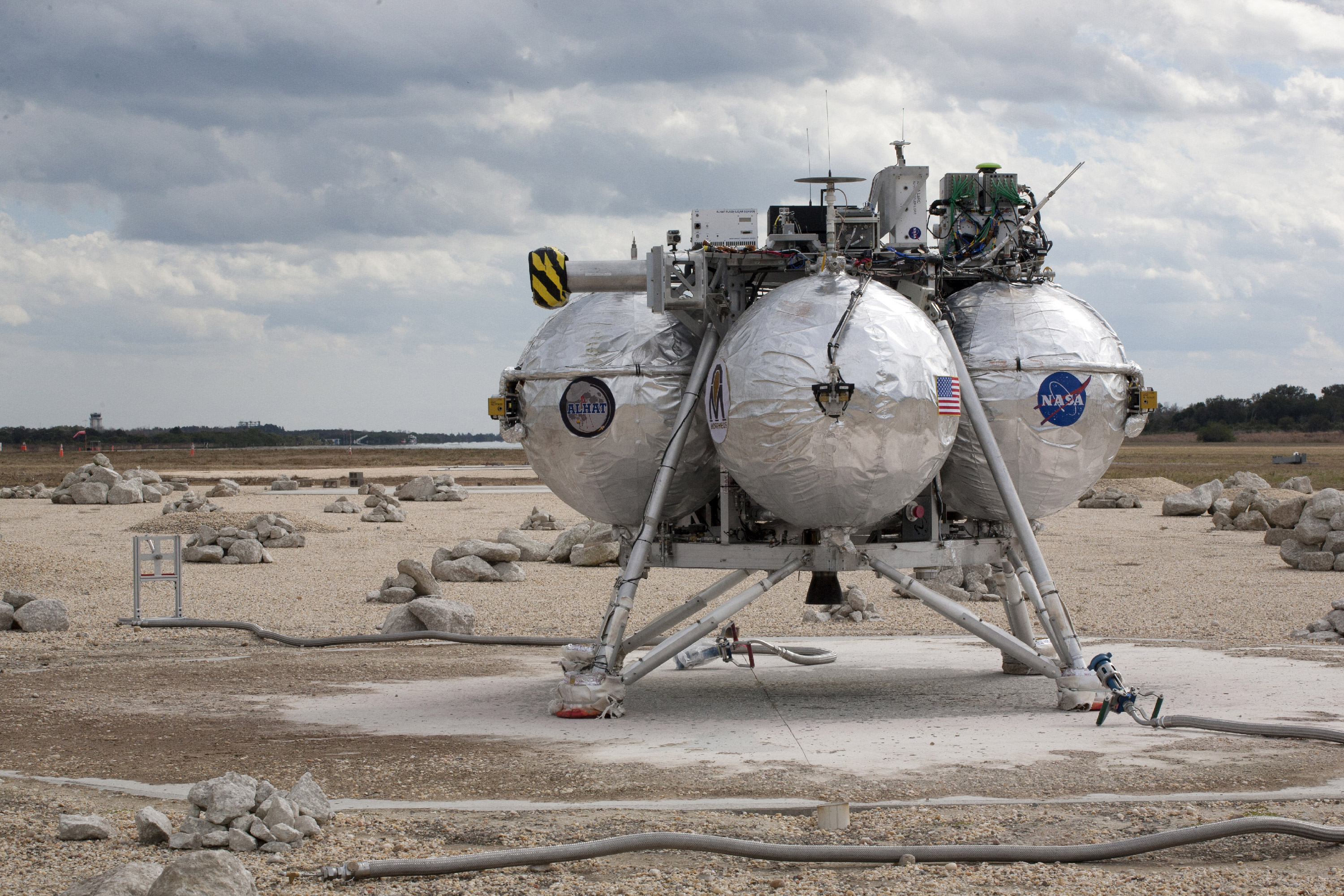 The Project Morpheus prototype lander successfully navigated the hazard field and touched down safely after launching into the sky on its fourth free-flight test. Credit: NASA/Kim Shiflett