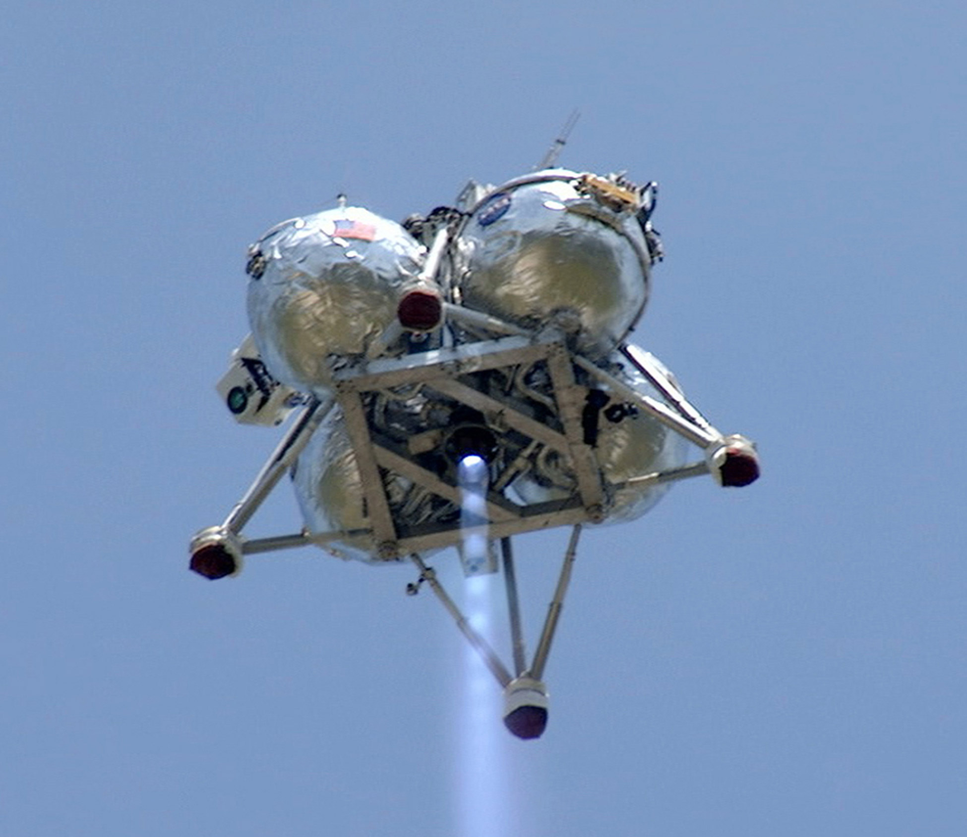 NASA’s Project Morpheus prototype lander performs a free-flight test from a launch pad at the north end of the Shuttle Landing Facility at NASA’s Kennedy Space Center in Florida. Credit: NASA/Mike Chambers and Chris Chamberland