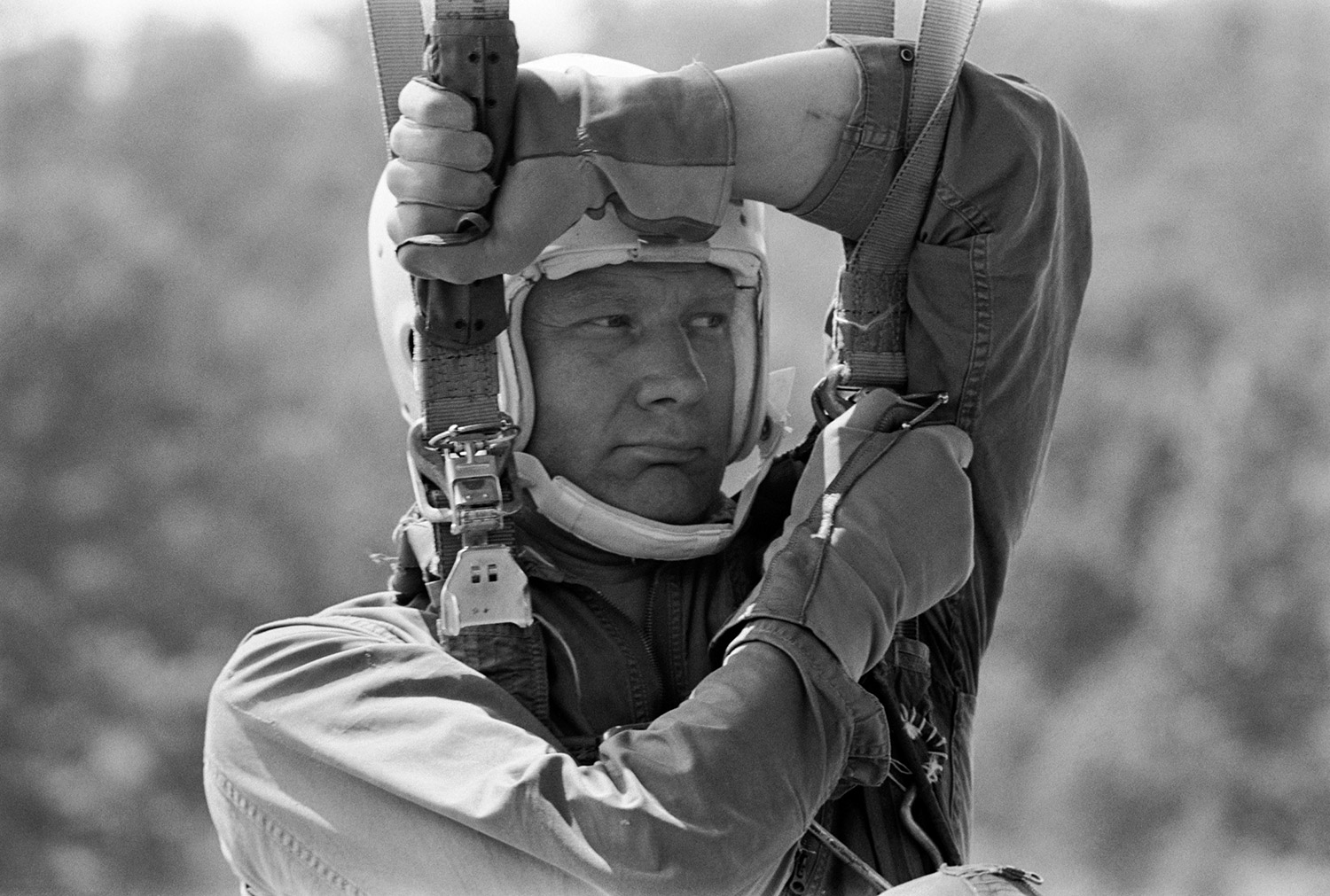 Hanging from a parachute harness, Buzz Aldrin undergoes aircraft ejection training at Perrin Air Force Base near Sherman, Texas during May of 1968. Credit: NASA via Retro Space Images