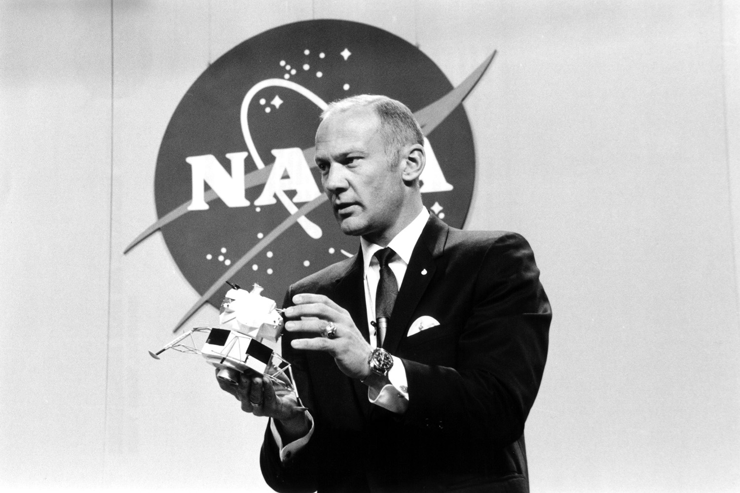 Buzz Aldrin holds up a model of the lunar lander during a press conference to announce the crew members for Apollo 11. The briefing was hel d in Houston, Texas on Jan. 10, 1969. Credit: NASA via Retro Space Images
