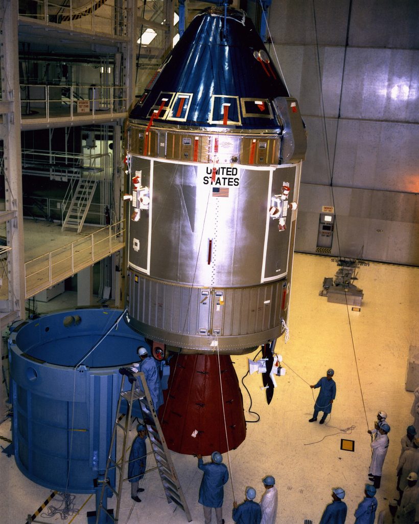 The Apollo Spacecraft 107 Command and Service Modules being moved from workstand 134 for mating to the Spacecraft Lunar Module Adapter (SLA) while inside the Manned Spacecraft Operations Building at KSC during April of 1969.