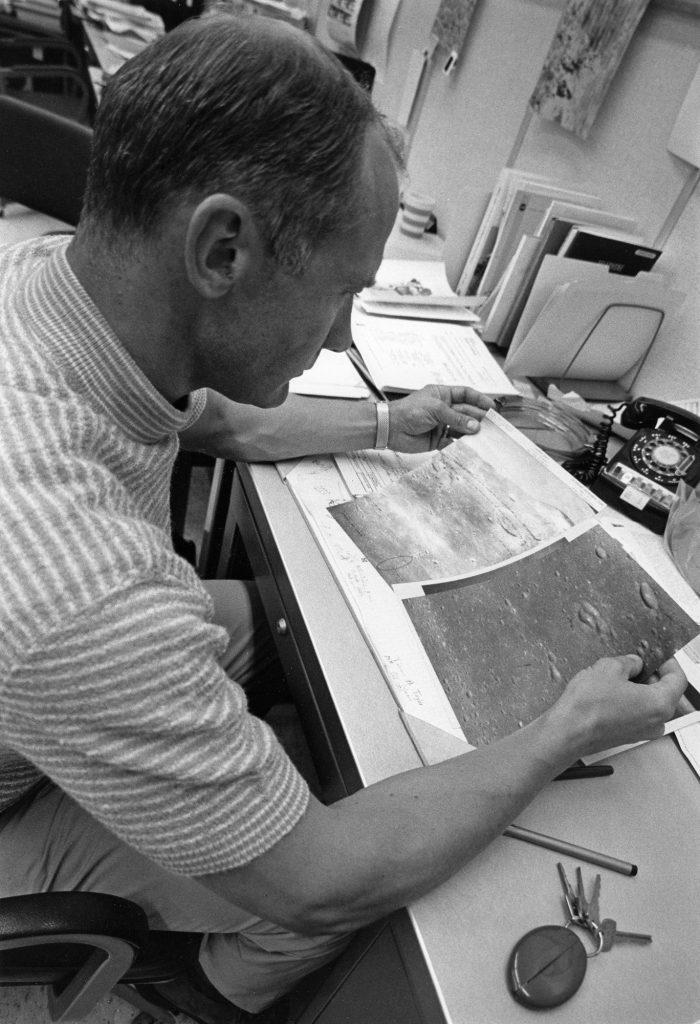 Edwin “Buzz” Aldrin reviews photos of the lunar surface at KSC on July 14, 1969.