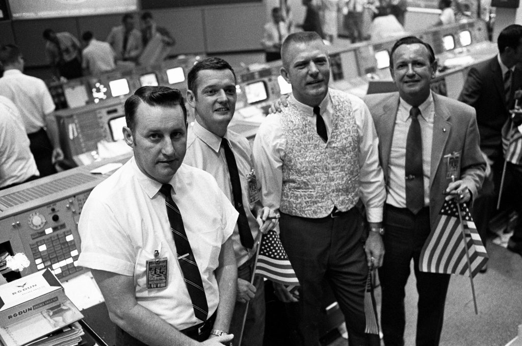 Flags were a common site in Mission Control as they cheered the successful splashdown of Apollo 11 on July 24, 1969.