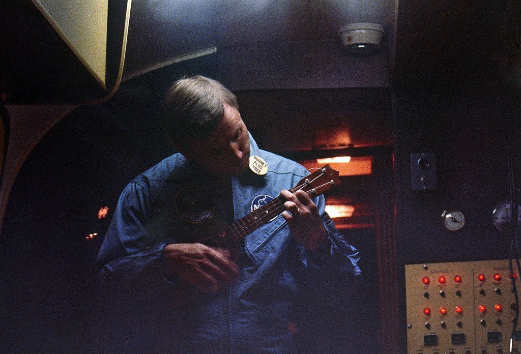 Armstrong strums a ukulele inside the quarantine facility aboard the USS Hornet on July 24, 1969.