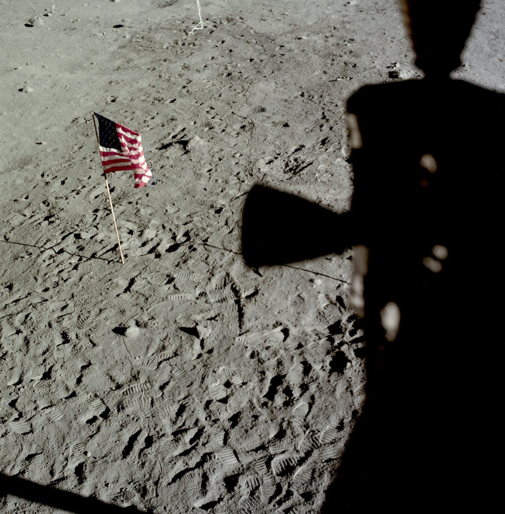 The American flag left on the Moon is viewed from the Eagle LM . The flag was blown over by the exhaust from the ascent engine during the return to orbit.