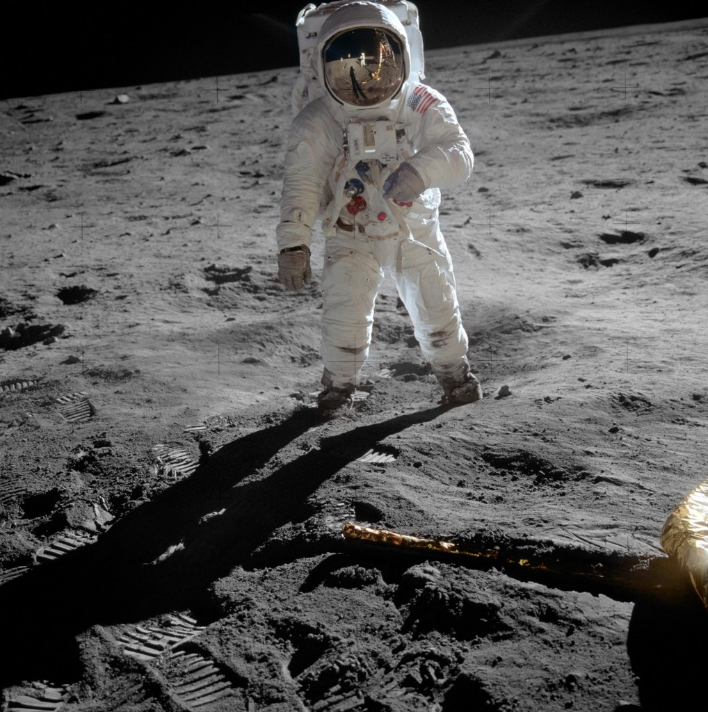 Edwin ‘Buzz’ Aldrin walks on the lunar surface. The plexiglass of his helmet reflects back the scene in front of him, including Neil Armstrong taking his picture. 