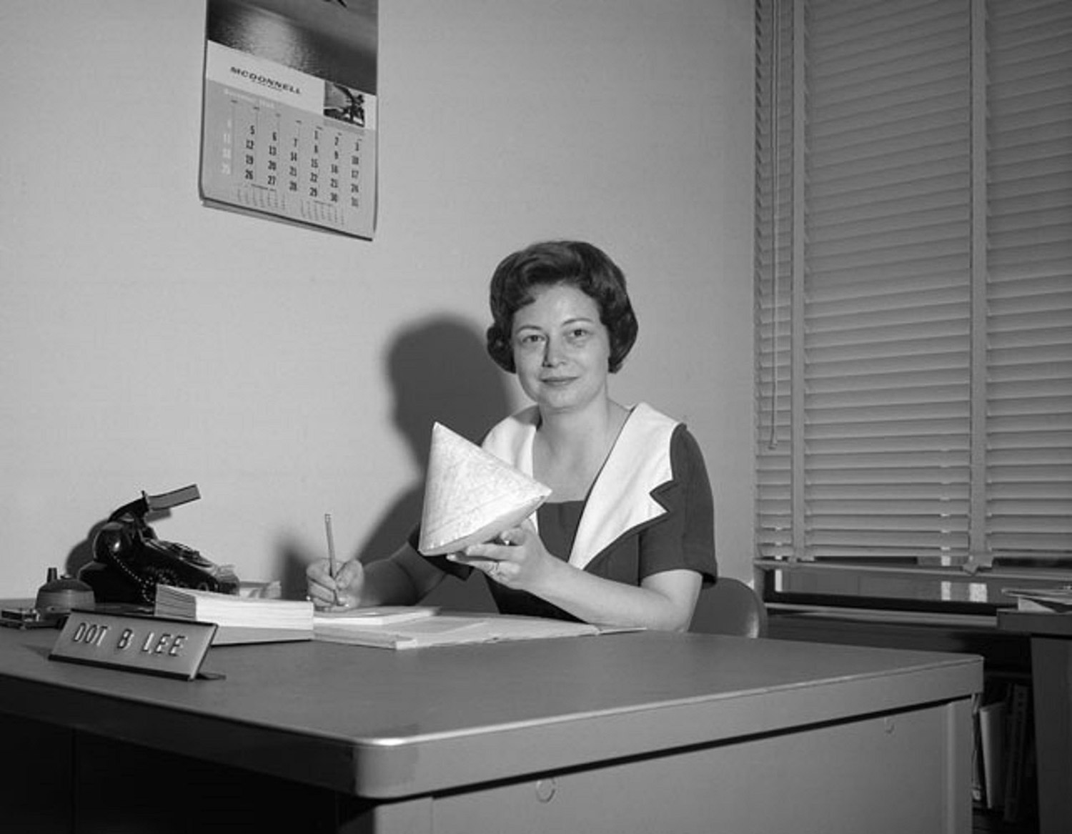 Dorothy Lee, the “human computer with a calculator” hard at work developing re-entry predictions for Apollo. Credit: NASA Johnson Space Center