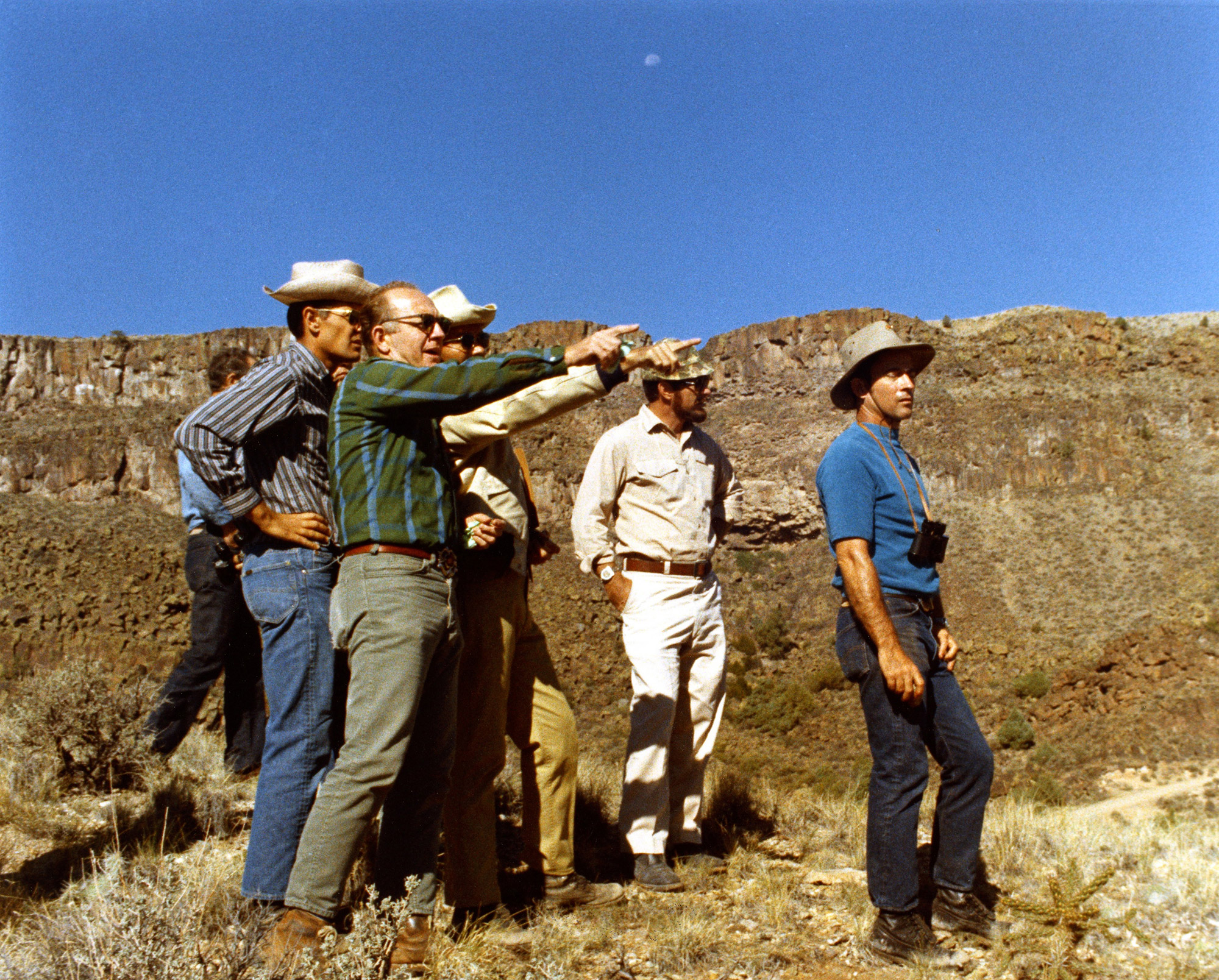 Lee Silver points out some geological observations to his astro-geologists in training, Charlie Duke and John Young. Credit: NASA/U.S. Geological Survey via Retro Space Images