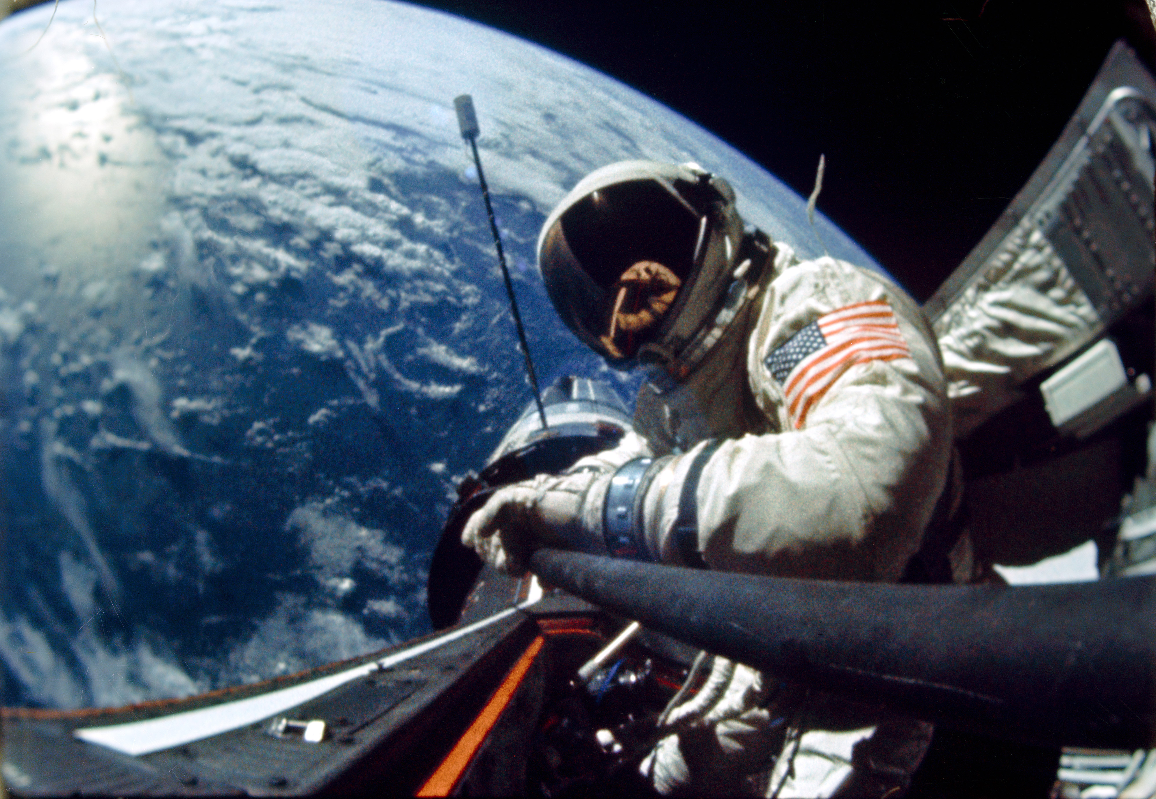 Buzz Aldrin performs an EVA during the Gemini XII mission. The Agena Target Vehicle is visible in the background. Credit: NASA