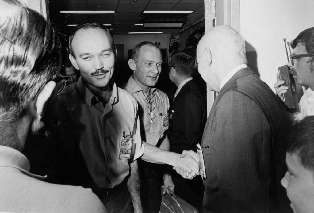 The Apollo 11 crew is greeted by Dr. Robert R. Gilruth, director of the Manned Spacecraft Center upon the astronanuts’ release from quarantine on August 19, 1969.
