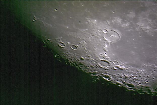 Using a cheap webcam the surface details of the moon can be seen clearly. Credit: Mike Barrett