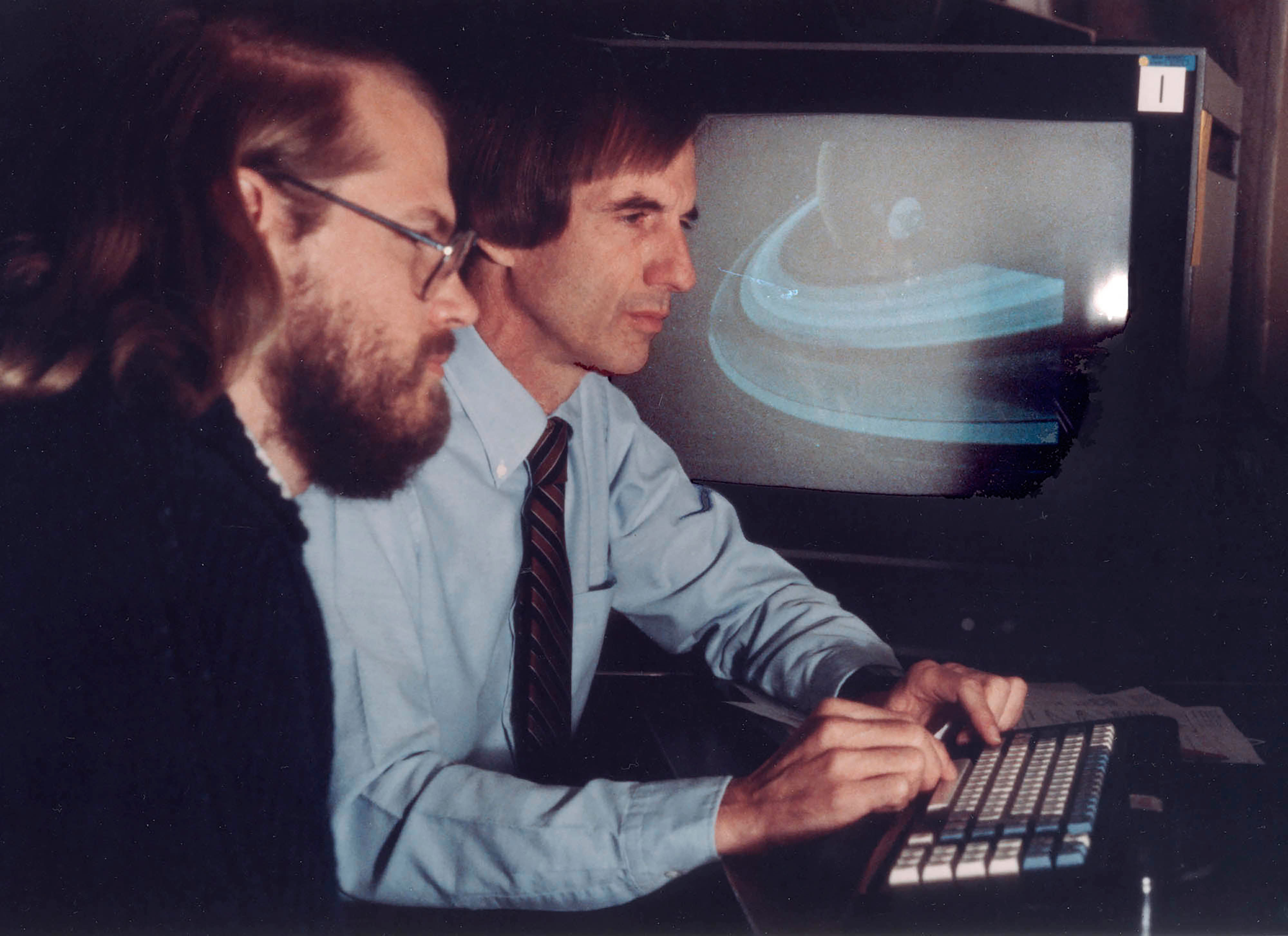 James Blinn (far left) and Charles Kohlhase working at JPL on the revolutionary computer animations of the planned Voyager encounters with the outer planets. Credit: Charles Kohlhase