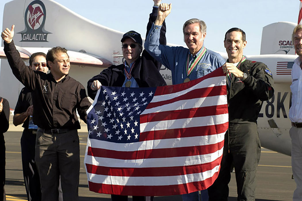 Peter Diamandis, Paul Allen, Burt Rutan and Brian Binnie celebrate. Credit: Don Logan