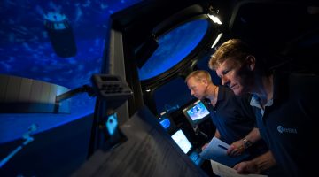 Expedition 47 (Soyuz 45) crew members Tim Kopra and Timothy Peake during training in the SES Alpha Cupola.  Credit: NASA/Lauren Harnett
