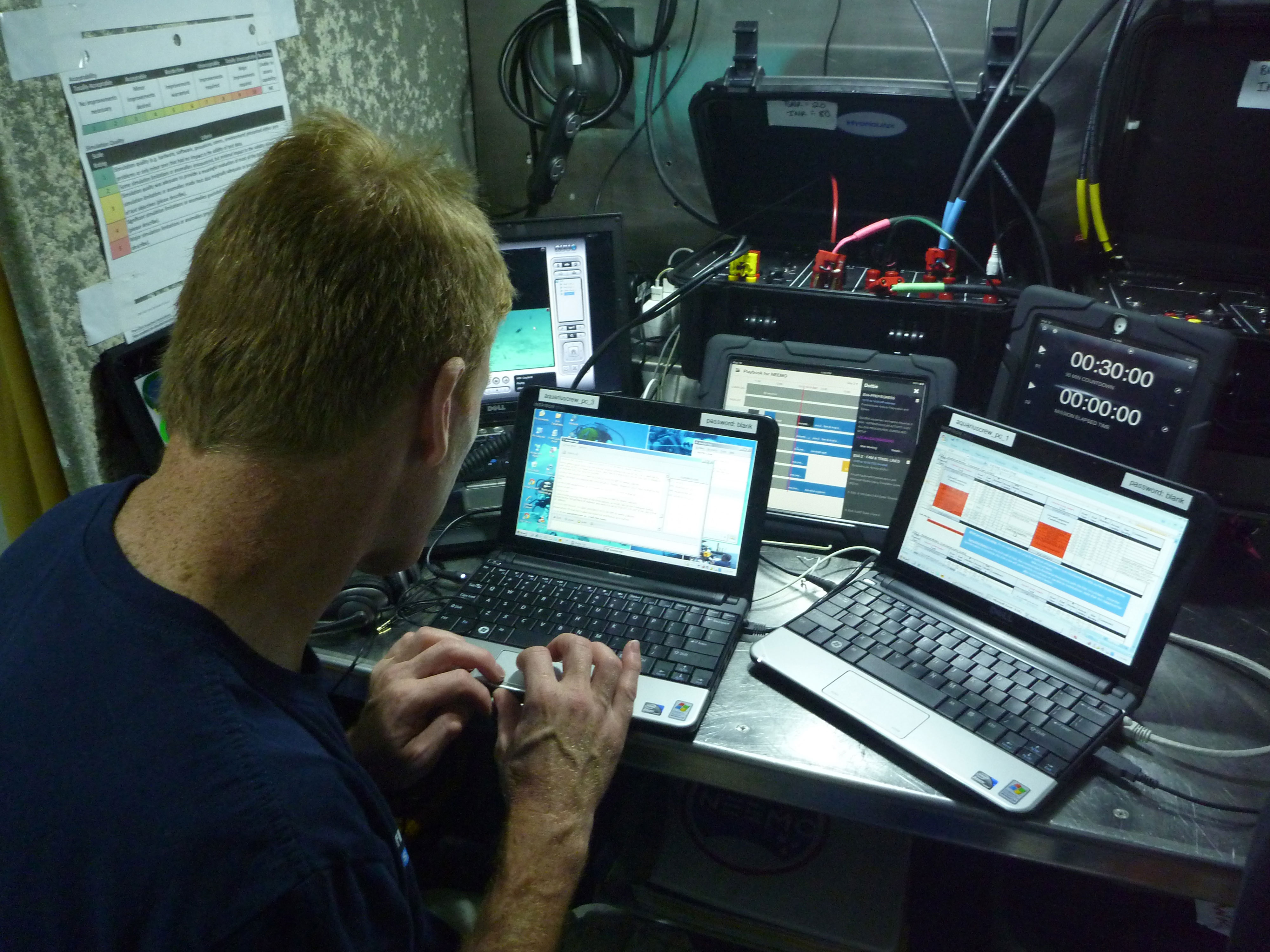 Tim Peake coordinates an EVA training session from inside the Aquarius underwater habitat. Credit: NASA