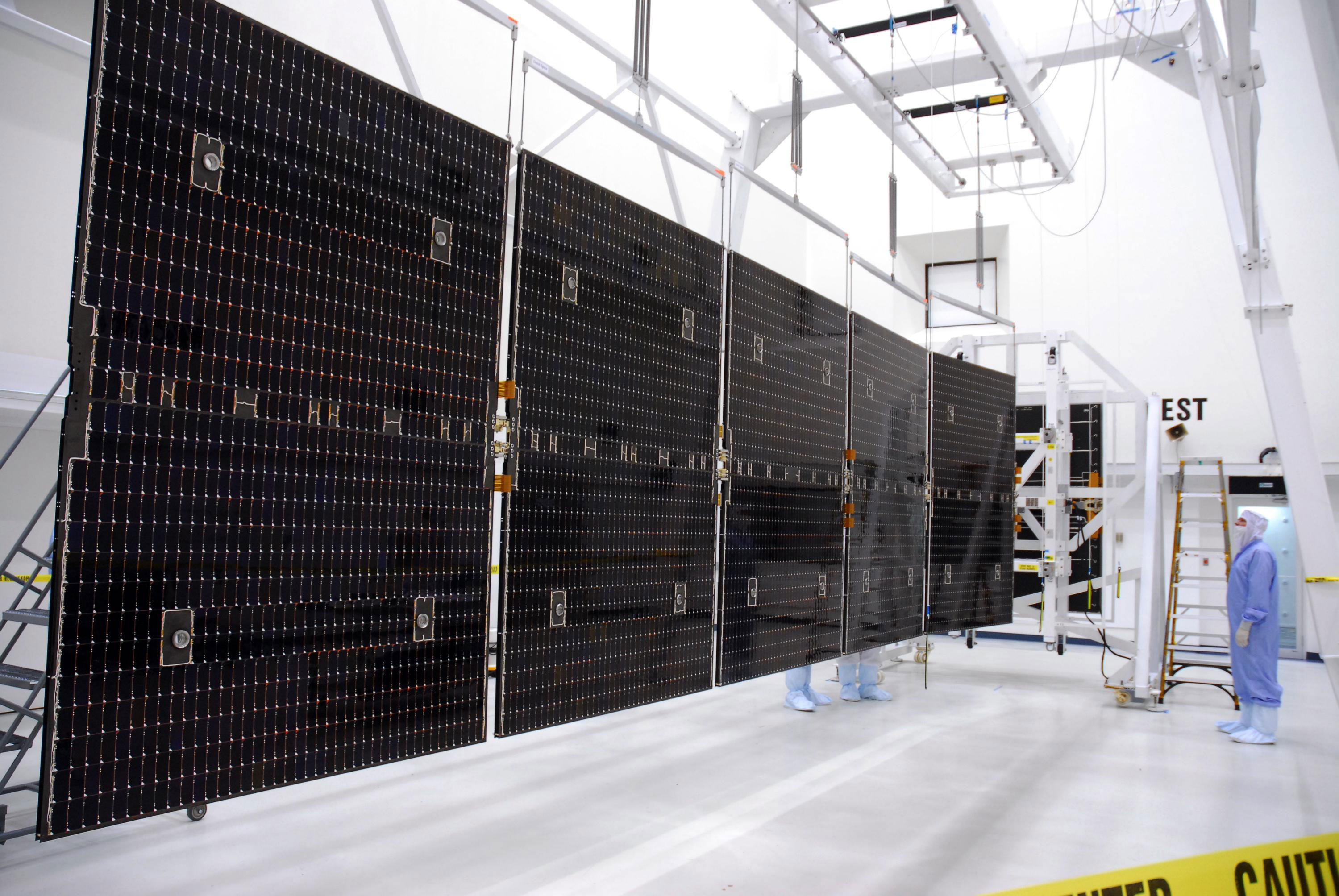 These are key in providing power for its ion propulsion system and for its instruments and on-board systems at a distance of almost 3 AU from the Sun. With its solar arrays fully extended, the spacecraft is 19.7 meters (65 ft) long. The solar arrays have a total area of 36.4 square metres (392 sq ft). Credit: NASA/George Shelton