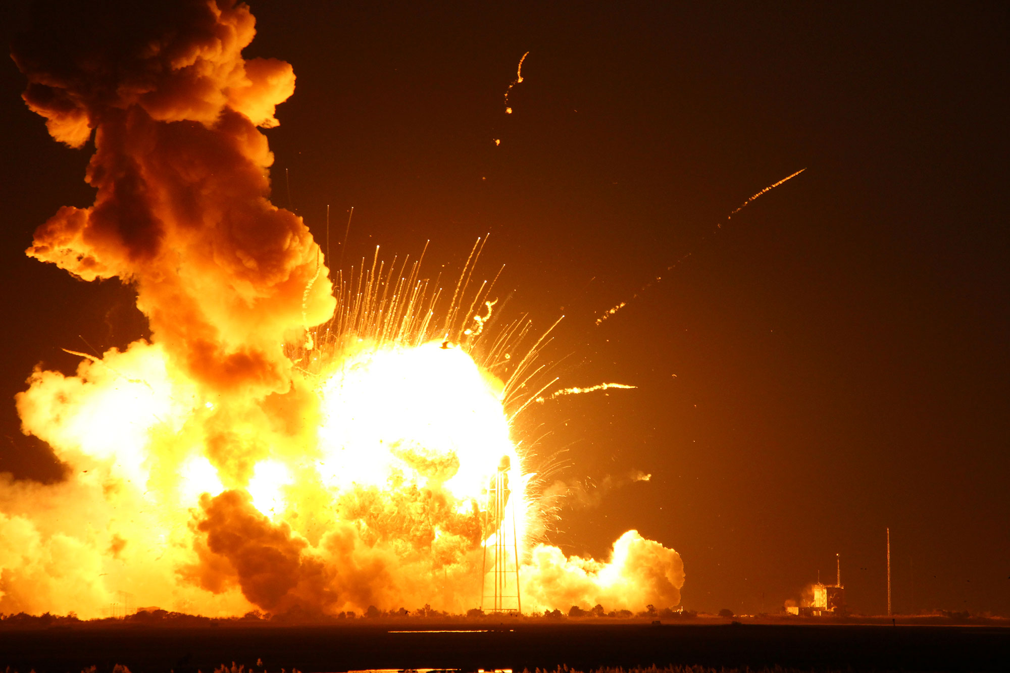 The aerial fireball that erupted from the Antares rocket seconds after blastoff could be seen for many miles. The pressure wave and heat wave from the explosion were even felt at the press site nearly two miles away from the launch pad. Credit: Ken Kremer