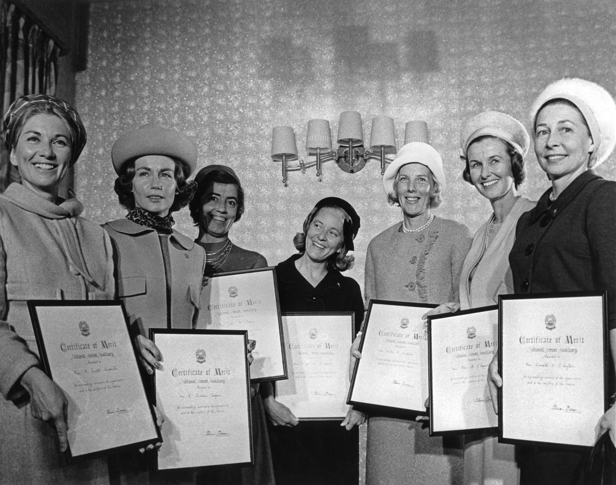 Group shot of wives taken in 1963 at a Ladies Auxiliary event in Washington, D.C. From left are: Carpenter, Cooper, Glenn, Grissom, Schirra, Shepard and Slayton. Credit: NASA via Retro Space Images