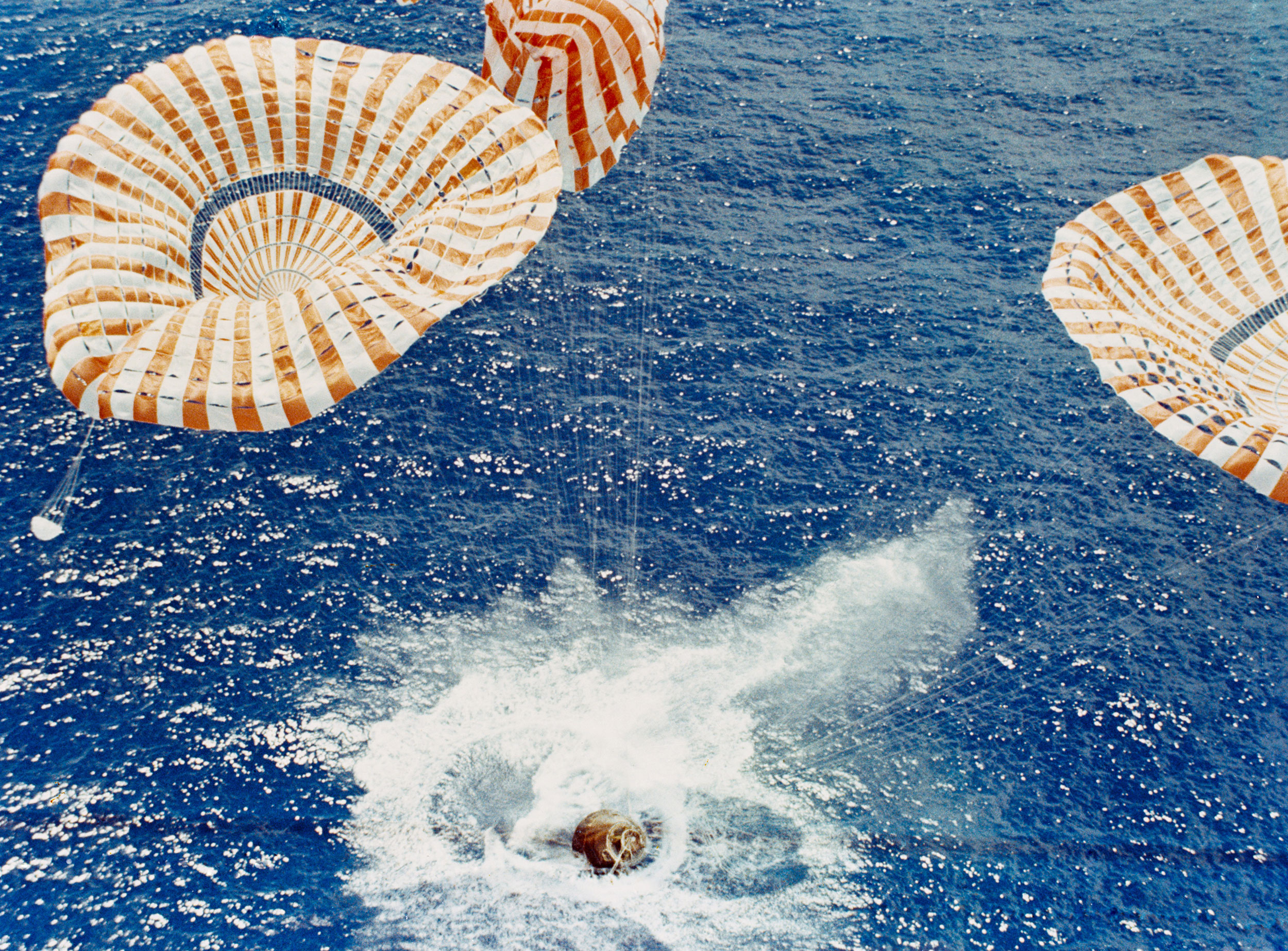 The Apollo 15 Command Module safely touches down in the mid-Pacific Ocean even though one of the three main parachutes failed to function properly. Credit: NASA
