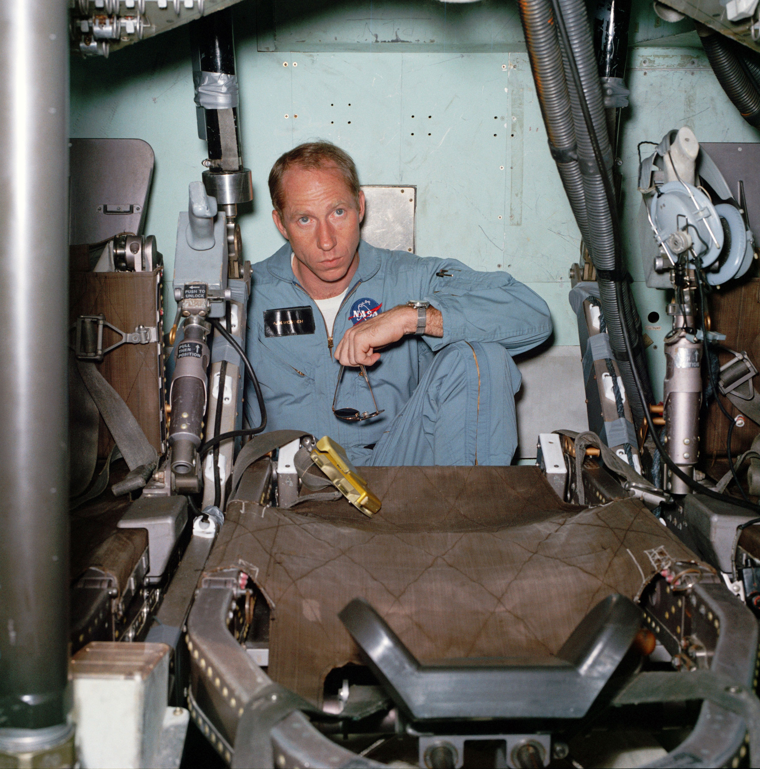 Worden sits alone inside the Command Module mockup during training before the Apollo 15 mission. Credit: NASA via Retro Space Images