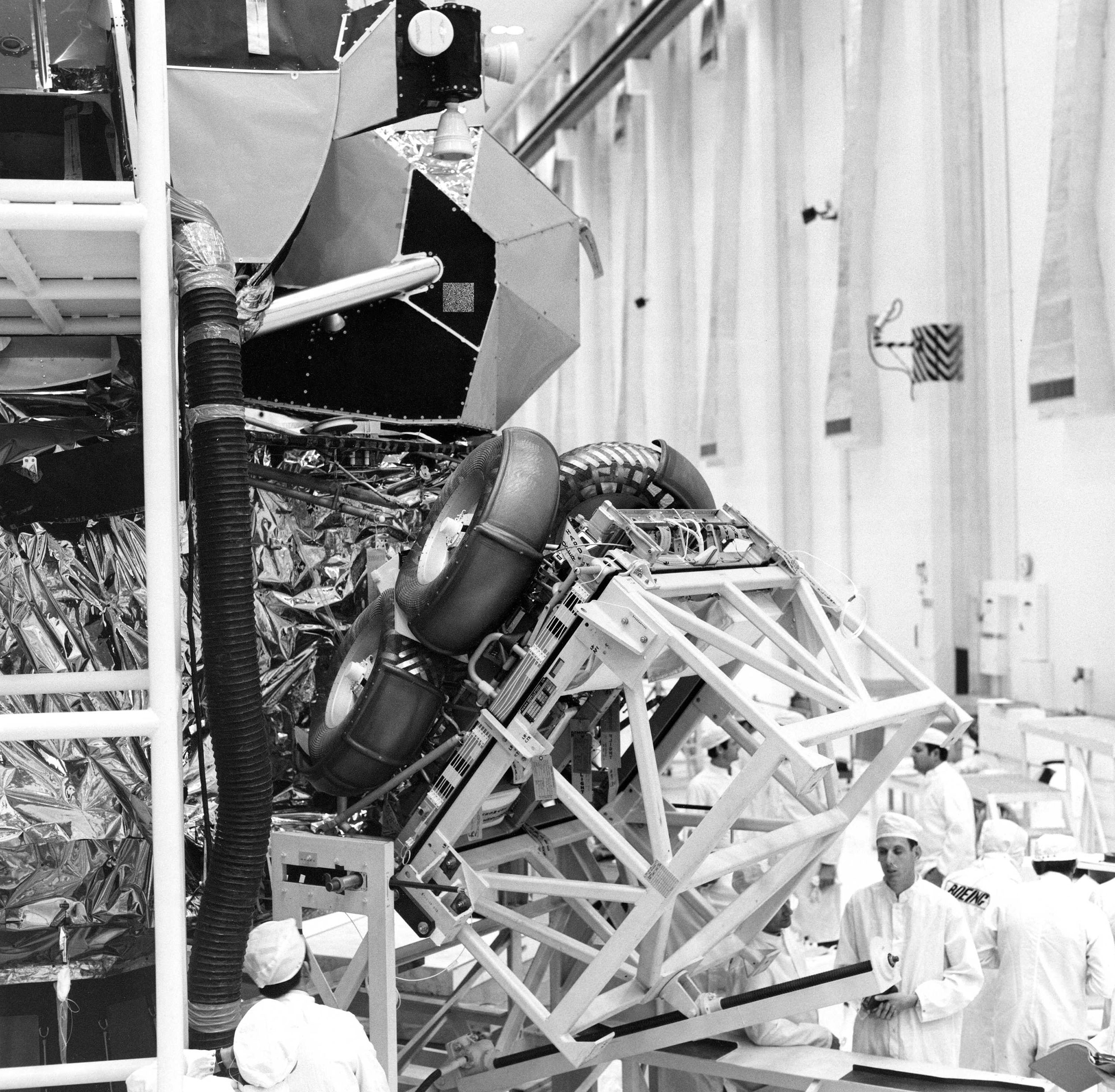 The Lunar Rover is folded up and being moved into its stored position inside the Apollo 15 Lunar Module, where it will remain until its deployment on the Moon’s surface. Credit: NASA via Retro Space Images