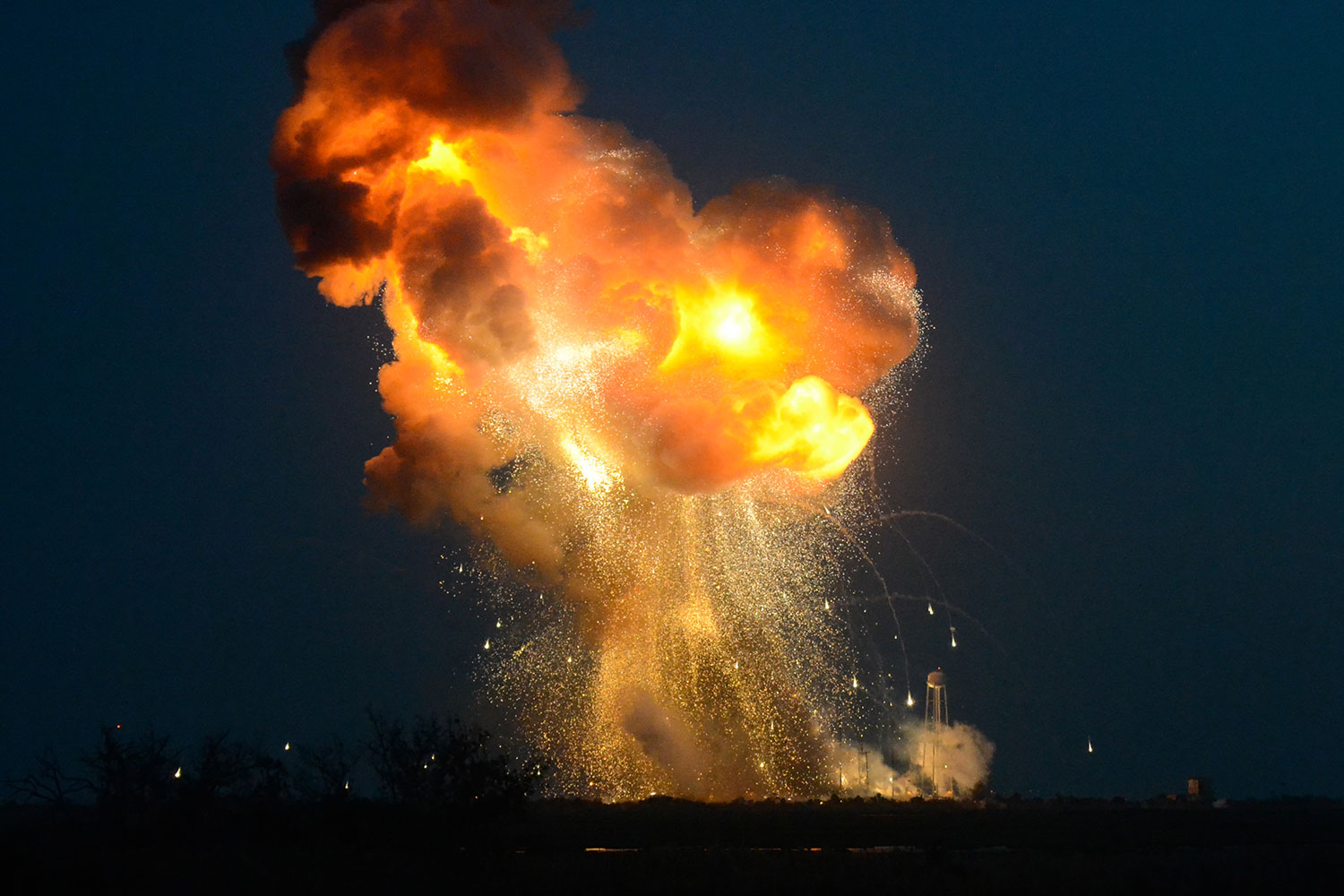 Seconds after liftoff, the ORB-3 Antares rocket fell near the launch pad due to an apparent failure in the turbopump supplying fuel to one of the two first-stage engines. Range Safety Officers engaged the Flight Termination System to stop the remaining engine. Credit: Elliot Severn