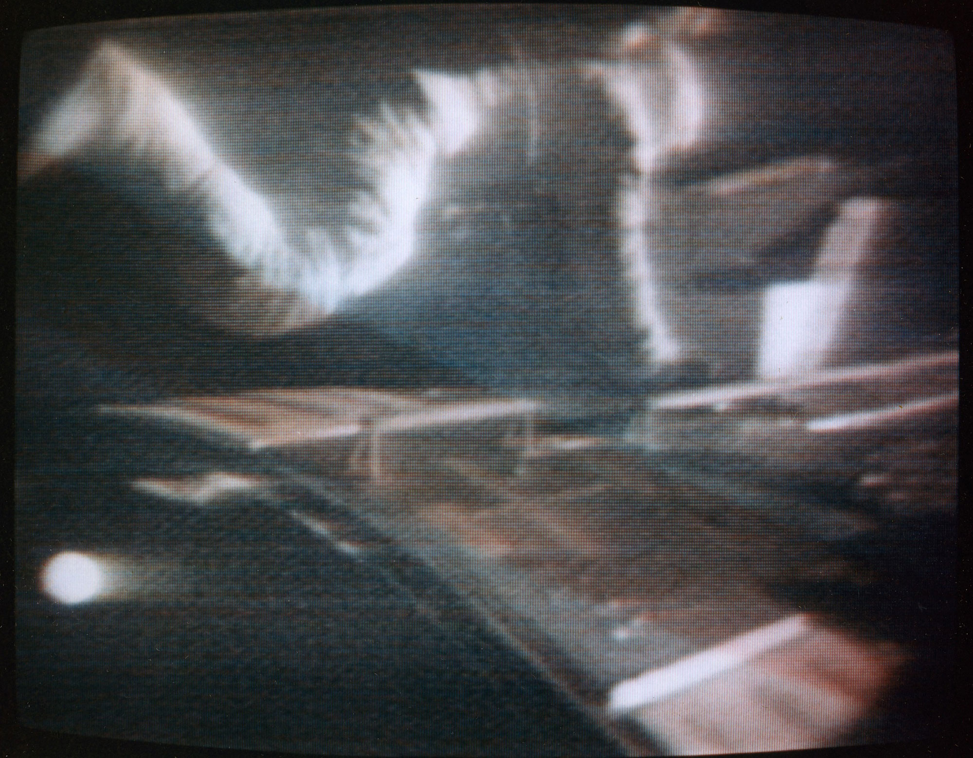 Still frame from a video of Worden during his EVA to retrieve film from cameras in the SIM bay of the Command Module. Credit: NASA via Retro Space Images