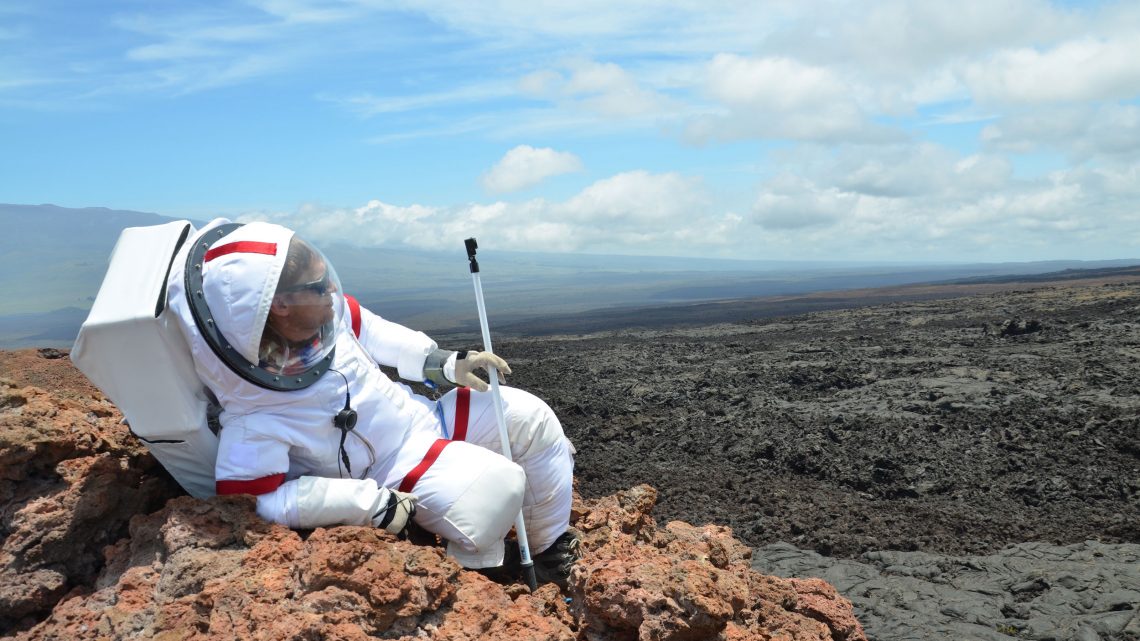 Ross Lockwood lounges on a rock outcrop outside the Hi-SEAS habitat. Credit: Ross Lockwood