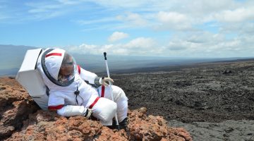 Ross Lockwood lounges on a rock outcrop outside the Hi-SEAS habitat. Credit: Ross Lockwood
