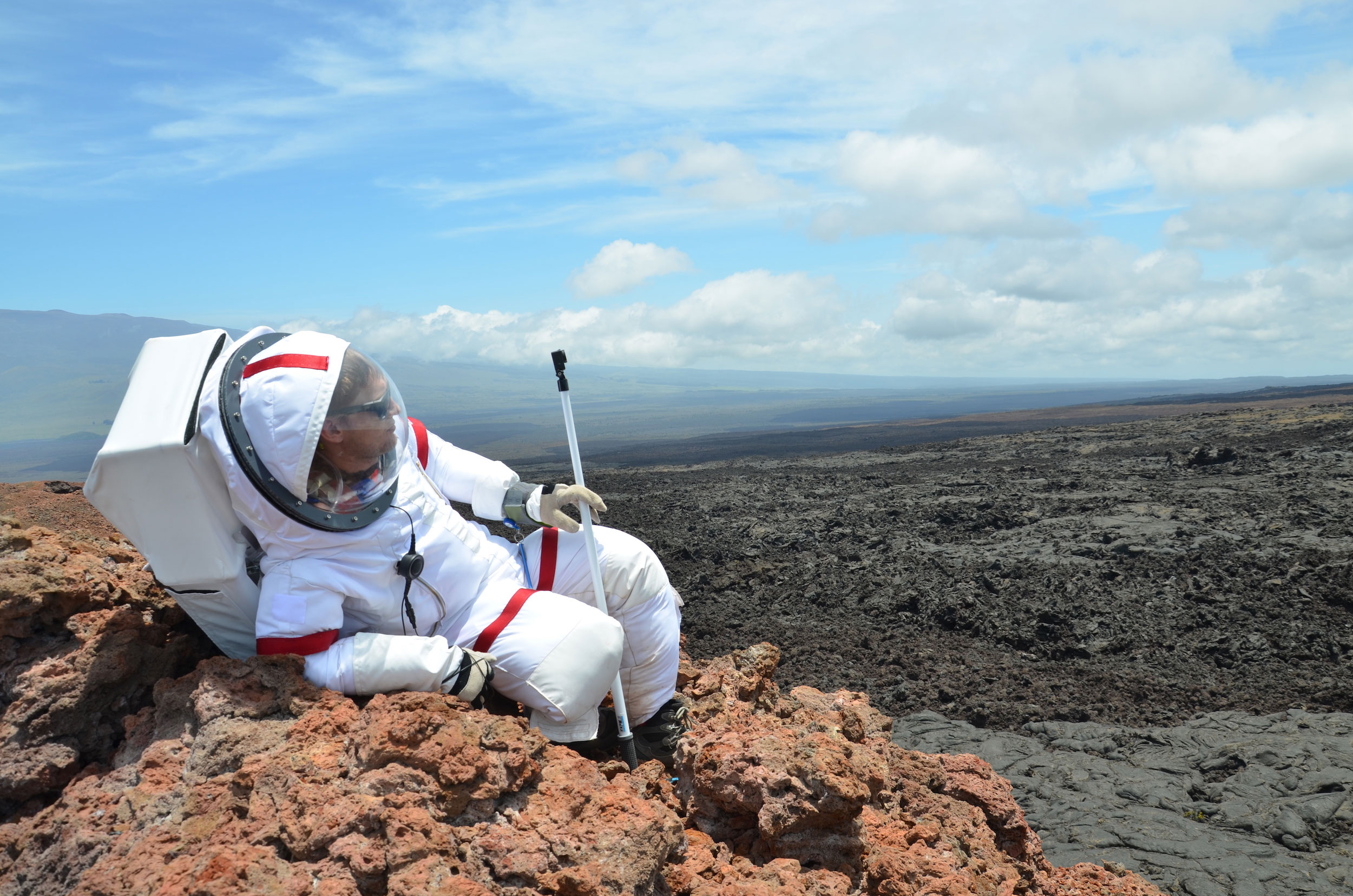 Ross Lockwood lounges on a rock outcrop outside the Hi-SEAS habitat. Credit: Ross Lockwood