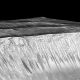 Dark narrow streaks called recurring slope lineae emanating out of the walls of Garni crater on Mars. The dark streaks here are up to few hundred meters in length. They are hypothesized to be formed by flow of briny liquid water on Mars. Credit: NASA/JPL/University of Arizona