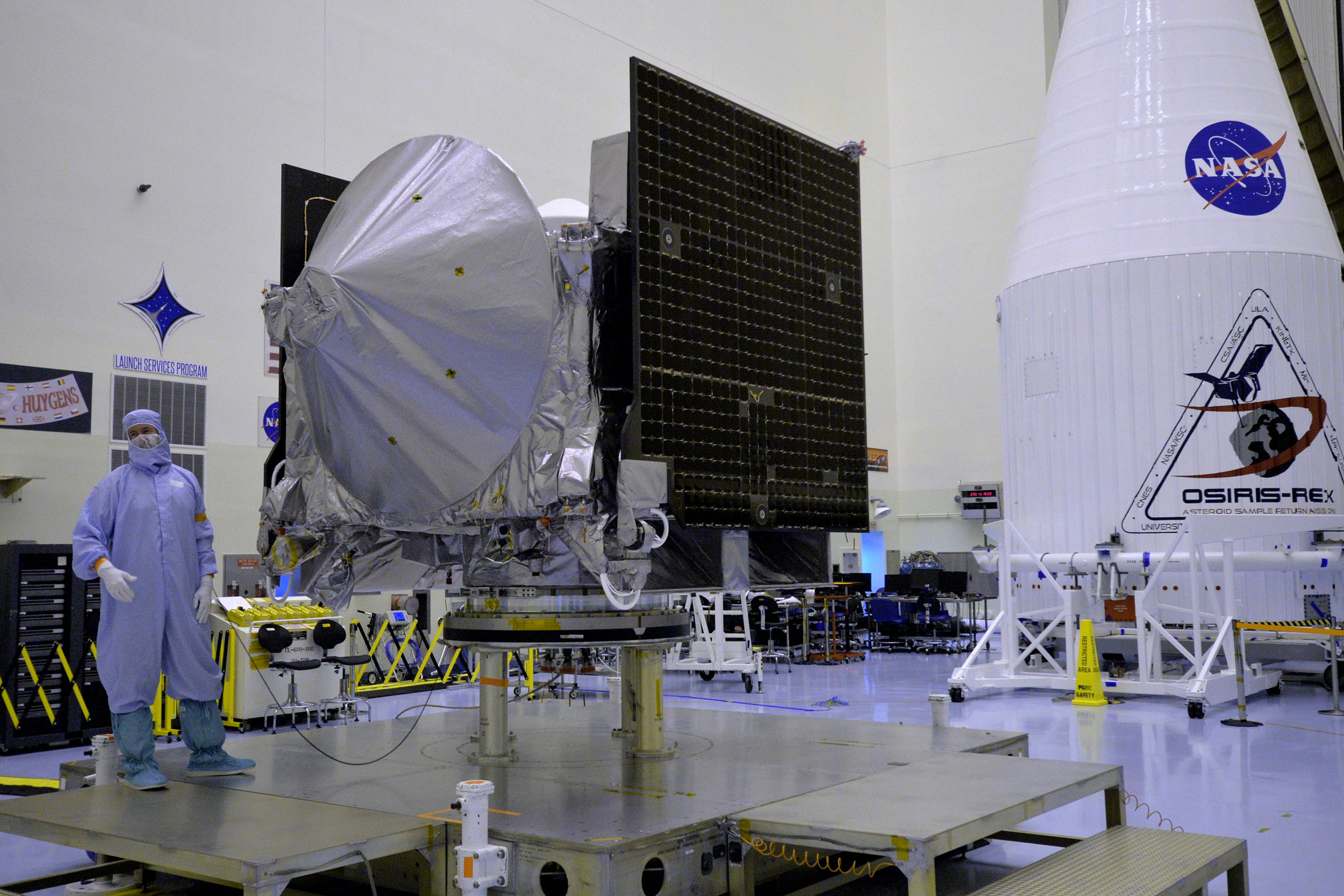 The OSIRIS-REx spacecraft resides in cleanroom as it undergoes final preparations before encapsulation for launch aboard an Atlas V rocket on Sept. 8. Credit: Julian Leek/JNN