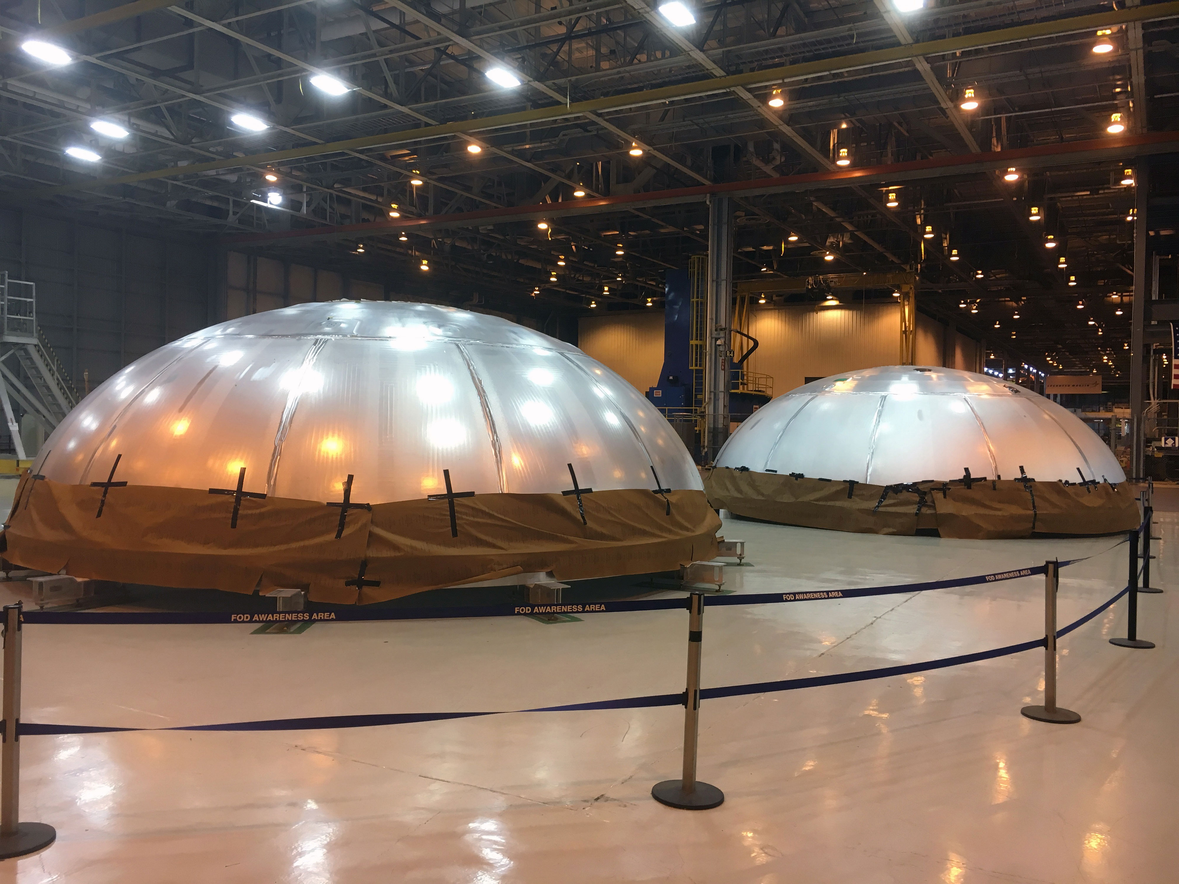 Two fuel tank domes were recently finished for the SLS rocket. One is a qualification article and the other is the actual flight article for the first mission (EM-1) set to launch in 2018. Credit: Chase Clark