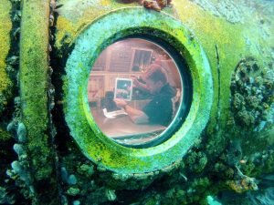 Tim Peake conducts a live video link from the Aquarius underwater habitat with the UK Space Environment Conference, in Aberdeen, Scotland. Credit: ESA/Hervé Stevenin