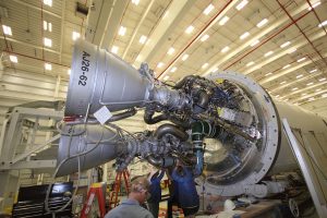 Orbital Sciences’ technicians at work on two AJ26 first stage engines at the base of an Antares rocket at NASA Wallops. The refurbished, Soviet era NK-33 engines most likely caused the Antares rocket failure in late 2014. Credit: Ken Kremer
